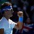 Bernard Tomic celebrates his second round win.