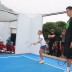 MLC Tennis Hot Shot winner Rachael Martin and Bernard Tomic.