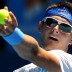 Bernard Tomic serves in his match against Feliciano Lopez.
