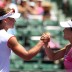 Sam Stosur (left) and Zheng Jie shake hands following Stosur's straight-sets win in Miami. GETTY IMAGES