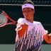 Bernard Tomic returns serve against Carlos Berlocq in the first round clash at the 2011 French Open. Getty Images