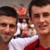 Novak Djokovic (left) with Bernard Tomic after their practice session at Roland Garros.