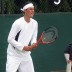 Bernard Tomic prepares to receive serve during his final round Wimbledon qualifying match.