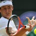 Australian player Bernard Tomic returns during his quarterfinal loss to Novak Djokovic at Wimbledon. Getty Images