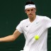 Bernard Tomic in action during his first round win at Wimbledon 2011. Getty Images