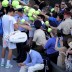 Look who's popular: Bernard Tomic signs autographs for his new fans after dispatching fifth seed Robin Soderling in the third round. GETTY IMAGES