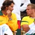 Pat Rafter (left) and Lleyton Hewitt talk tactics. GETTY IMAGES