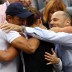 Stosur celebrates with coach Dave Taylor and manager Paul Kilderry