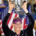 Stosur holds the women's singles trophy high