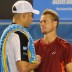 Lleyton Hewitt commiserates with Andy Roddick (left) after the American retired during their second-round match. AFP