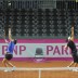 Synchronised serving in Fribourg: Sam Stosur (left) and Casey Dellacqua. (freshfocus)