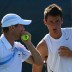 Tomic (R) looked to continue his run in Miami in the doubles draw when he paired with compatriot Paul Hanley, but the wildcard duo fell to American top seeds Bob and Mike Bryan; Getty Images