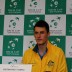 Bernard Tomic greets the press