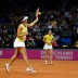 Casey Dellacqua plays a forehand as partner Jarmila Gajdosova watches on; Getty Images