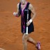 Sam Stosur of Australia celebrates after winning against Andrea Petkovic, a victory that sealed an unassailable 3-0 lead for the Aussies and returns them to the World Group; Getty Images