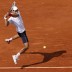 Top seed Novak Djokovic plays an athletic backhand during his 7-6(3) 6-3 6-1 first-round win over Italian Potito Starace on Day 2 at Roland Garros; Getty Images