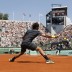 World No.3 Roger Federer swats a forehand back in his match against German Tobias Kamke on Court Suzanne Lenglen during Day 2 of the French Open, which he won 6-2 7-5 6-3; Getty Images