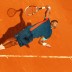 French fifth seed Jo-Wilfried Tsonga stretches for a serve beneath sunny skies on Day 1 at the 2012 French Open. After dropping the opening set, Tsonga came back to defeat Russia's Andrey Kuznetsov 1-6 6-3 6-2 6-4; Getty Images