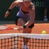 Australia's Casey Dellacqua chases down a drop shot in her first round match against Italian 21st seed Sara Errani. Dellacqua led by a set and a break before falling 4-6 6-2 6-2; Getty Images
