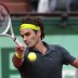Switzerland's Roger Federer hits a return during his semifinal loss to Novak Djokovic at the French Open; Getty Images