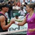 Italy's Sara Errani (R) shakes hands with Sam Stosur of Australia following Errani's win in the French Open semifinals; Getty Images