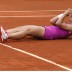 Sara Errani collapses to the court in disbelief following her 7-5 1-6 6-3 win over Sam Stosur, her first win over the Australian sending her through to her first career Slam final; Getty Images