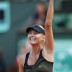 A delighted Maria Sharapova waves to the crowd on Court Philippe Chatrier after winning through to the French Open final in Paris; Getty Images