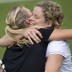 Maria Sharapova (left) and Kim Clijsters embrace at a practice session, Wimbledon, 2012. AFP