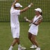 Americans Mike Bryan (L) and Lisa Raymond celebrate their 6-3 5-7 6-4 victory over Leander Paes and Elena Vesnina in the final of the mixed doubles event at Wimbledon; Getty Images