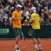 Chris Guccione (left) and Lleyton Hewitt talk tactics, Hamburg, 2012. TENNIS AUSTRALIA
