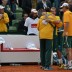 Hugs all round: team captain Pat Rafter and Lleyton Hewitt embrace after the doubles rubber. TENNIS AUSTRALIA