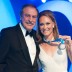 Sam Stosur (R) poses with the Newcombe Medal alongside presenter John Newcombe, after winning the award for the third consecutive year for Australia's most outstanding elite tennis player; Bek Johnson