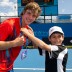 Ben Mitchell (left) receives his AO 2013 accreditation from Emmanuel Valsamis at Melbourne Park. XUE BAI