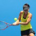 Casey Dellacqua of Australia plays a backhand in her first round women's doubles match with Ashleigh Barty of Australia against Polona Hercog of Slovakia and Francesca Schiavone of Italy during day three of the 2013 Australian Open at Melbourne Park on January 16, 2013 in Melbourne, Australia; Getty Images Casey Dellacqua - 2013 Australian Open - Day 3