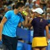 Aussies Bernard Tomic and Ashleigh Barty discuss tactics during their mixed doubles match against Novak Djokovic and Ana Ivanovic of Serbia, which they ultimately lost in an exciting third-set match tiebreak; Getty Images