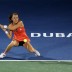 Agnieszka Radwanska plays her trademark crouch backhand in her quarterfinal loss against Petra Kvitova at the WTA Dubai Duty Free Tennis Championships; Getty Images