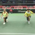 Australian Fed Cup captain Alicia Molik (L) and head of professional tennis Todd Woodbridge are put through a three-minute drill - consisting of suicides, push-ups, star jumps, burpies, sit-ups and lunges - dictated by Casey Dellacqua and Ash Barty, who won their doubles match in Fed Cup team practice against Molik and Woodbridge and therefore won a bet; Tennis Australia