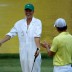 Rory McIlroy of Northern Ireland applauds caddie and girlfriend Caroline Wozniacki as she tries her hand with the clubs during the Par 3 Contest prior to the 2013 US Masters at Augusta National Golf Club; Getty Images