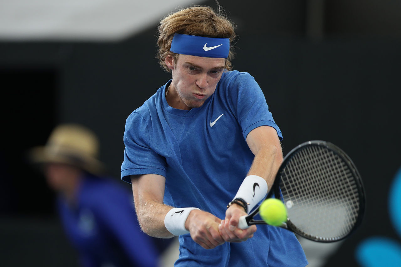 ADELAIDE, AUSTRALIA - JANUARY 16: Andrey Rublev of Russia plays a backhand to Daniel Evans of Great Britain during day five of the 2020 Adelaide International at Memorial Drive on January 16, 2020 in Adelaide, Australia. (Photo by Paul Kane/Getty Images)