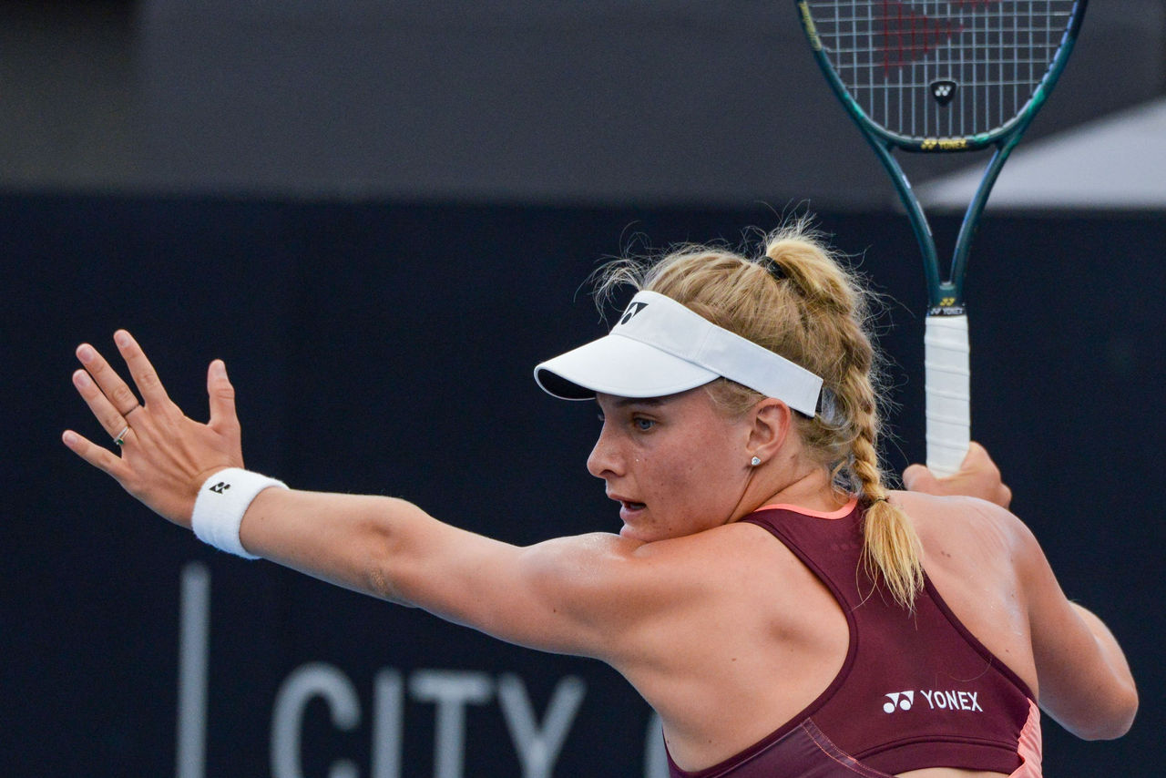Dayana Yastremska of the Ukraine hits a return to Angelique Kerber of Germany during their women's second round singles match at the Adelaide International tennis tournament in Adelaide on January 15, 2020. (Photo by Brenton EDWARDS / AFP) (Photo by BRENTON EDWARDS/AFP via Getty Images)