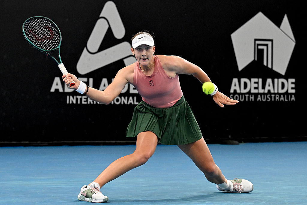 Russia's Mirra Andreeva hits a return to her compatriot Diana Shnaider during their women's singles semi-final match at the Adelaide International tennis tournament in Adelaide on January 16, 2026. (Photo by Michael ERREY / AFP via Getty Images) / -- IMAGE RESTRICTED TO EDITORIAL USE - STRICTLY NO COMMERCIAL USE --