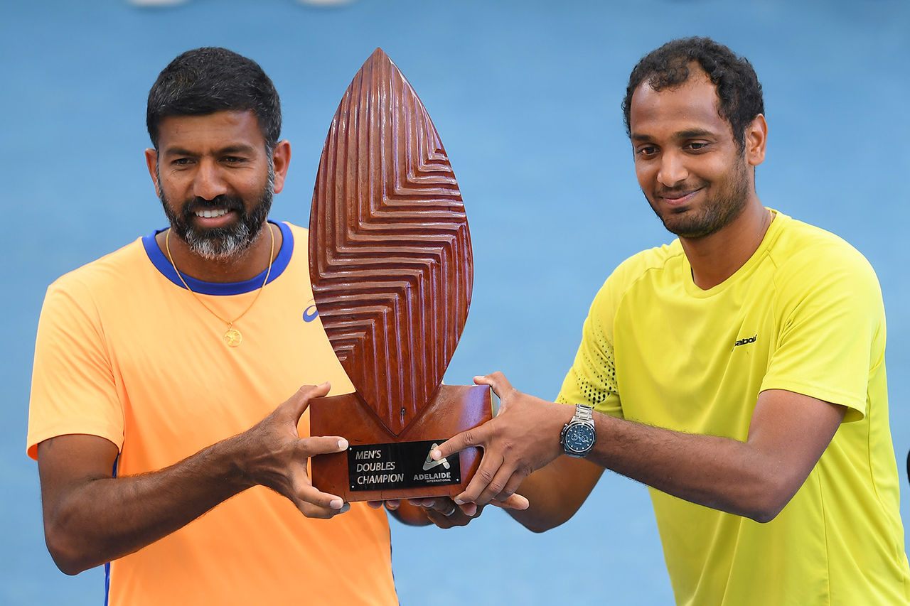 ADELAIDE, AUSTRALIA - JANUARY 09: Rohan Bopanna of India and Ramkumar Ramanathan of India  Mens Doubles winner hold up the trophy during day eight of the 2022 Adelaide International at Memorial Drive on January 09, 2022 in Adelaide, Australia. (Photo by Mark Brake/Getty Images)