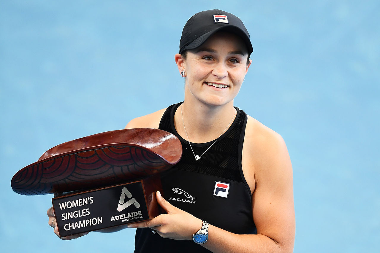 ADELAIDE, AUSTRALIA - JANUARY 09: Ashleigh Barty of Australia  holds the Womens Singles Champion trophy after defeating Elena Rybakina of Kazakhstan during day eight of the 2022 Adelaide International at Memorial Drive on January 09, 2022 in Adelaide, Australia. (Photo by Mark Brake/Getty Images)