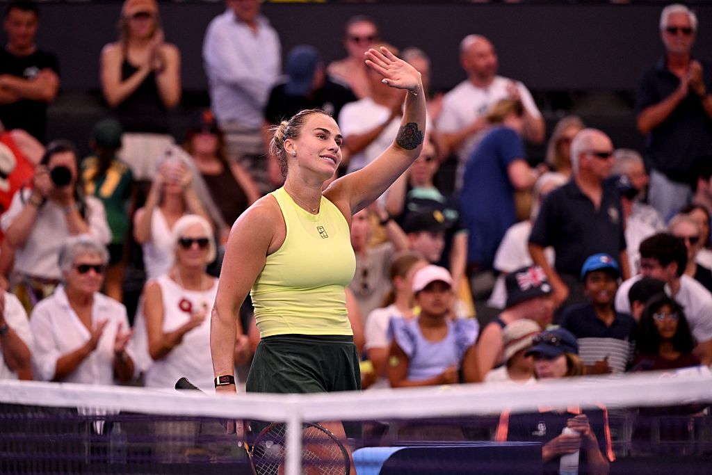 Aryna Sabalenka of Belarus waves to fans after winning her women's singles match against Madison Keys of the US at the Brisbane International tennis tournament in Brisbane on January 9, 2026. (Photo by William WEST / AFP via Getty Images) / --IMAGE RESTRICTED TO EDITORIAL USE - STRICTLY NO COMMERCIAL USE--