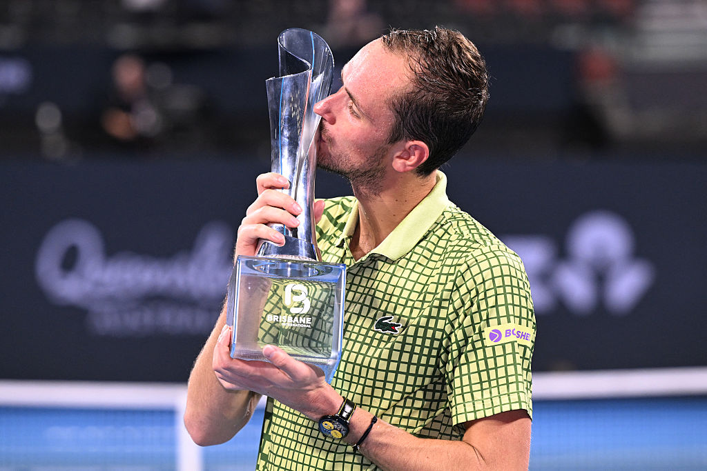 Daniil Medvedev of Russia kisses the trophy after winning the men's singles final against Brandon Nakashima of the US at the Brisbane International tennis tournament in Brisbane on January 11, 2026. (Photo by William WEST / AFP via Getty Images) / --IMAGE RESTRICTED TO EDITORIAL USE - STRICTLY NO COMMERCIAL USE--