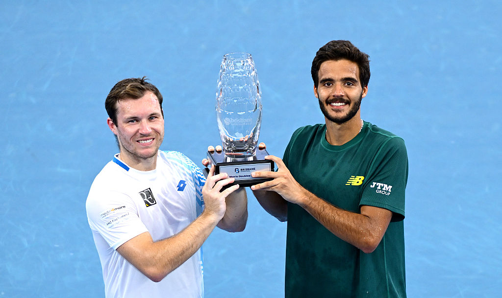BRISBANE, AUSTRALIA - JANUARY 11: Francisco Cabral of Portugal and Lucas Miedler of Austria celebrate victory as they pose for a photo after the men’s doubles final match against Julian Cash of Great Britain and Lloyd Glasspool of Great Britain during the 2026 Brisbane International at Pat Rafter Arena on January 11, 2026 in Brisbane, Australia. (Photo by Bradley Kanaris/Getty Images)