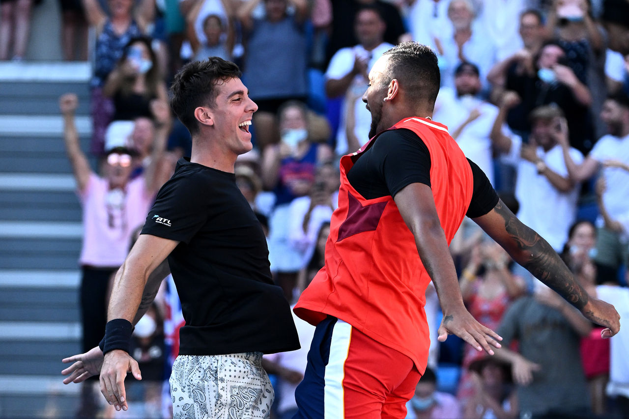 MELBOURNE, AUSTRALIA - JANUARY 25: Thanasi Kokkinakis of Australia and Nick Kyrgios of Australia celebrate match point in their Men's Doubles Quarterfinals match against Tim Puetz of Germany and Michael Venus of New Zealand during day nine of the 2022 Australian Open at Melbourne Park on January 25, 2022 in Melbourne, Australia. (Photo by Quinn Rooney/Getty Images)