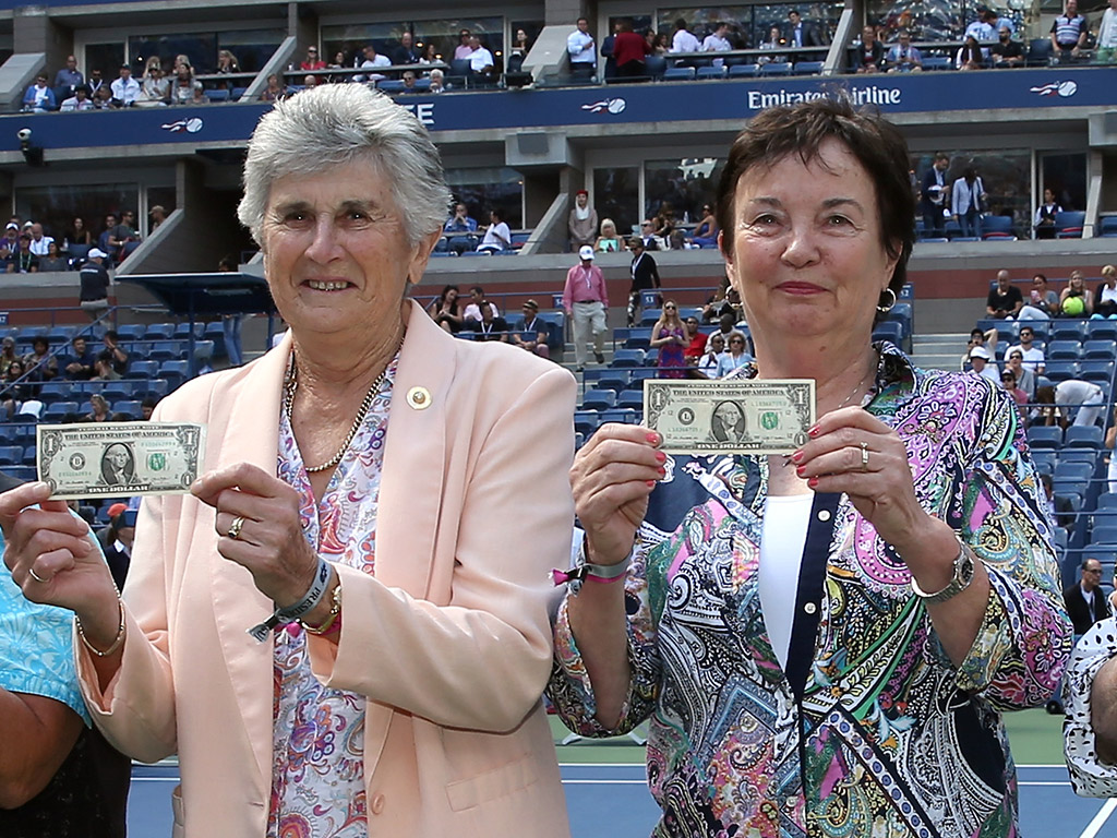 Australians Judy Tegart Dalton (L) and Kerry Melville Reid join other members of the Original Nine in posing with their symbolic  bills at the 2015 US Open