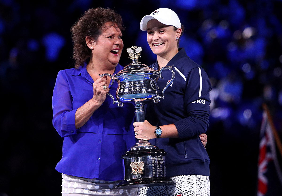 Australia's Ashleigh Barty poses with her trophy with former Australian tennis player Evonne Goolagong (L) following Barty's victory in the women's singles final match against Danielle Collins of the US on day thirteen of the Australian Open tennis tournament in Melbourne on January 29, 2022. - -- IMAGE RESTRICTED TO EDITORIAL USE - STRICTLY NO COMMERCIAL USE -- (Photo by Aaron FRANCIS / AFP) / -- IMAGE RESTRICTED TO EDITORIAL USE - STRICTLY NO COMMERCIAL USE -- (Photo by AARON FRANCIS/AFP via Getty Images)