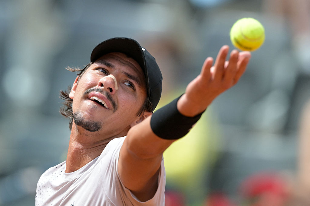 Australian Alexei Popyrin serves to Italian Matteo Berrettini during the ATP Rome Open tennis tournament at Foro Italico in Rome on May 7, 2026. (Photo by Tiziana FABI / AFP via Getty Images)